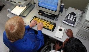 Computer Comfort Participant working with a Volunteer at a Computer Workstation