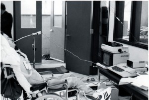 Neil Squire using sip and puff teletype machine