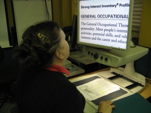Employ-Ability participant using an enlarger Employ-Ability participant using an enlarger
