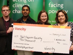 Munesh Raman, Suzanne Cross, and Josie Romeo holding the Vancity Cheque