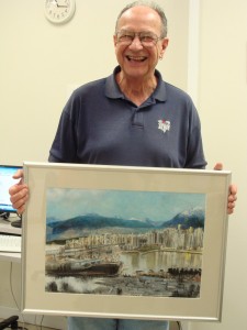 Gary holding his latest painting