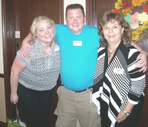 Murray (centre) at Stillwater Creek Retirement Residence with Activity Assistant Jennifer (left) and Activity Director, Diane (right)