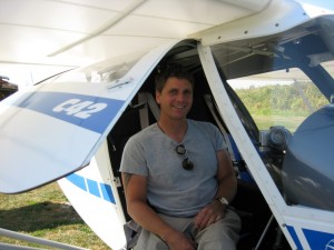 Ben posing in an Ultralight airplane