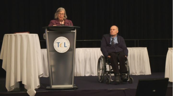 Symposium chair Anne MacRae introduces Dr. Gary Birch 