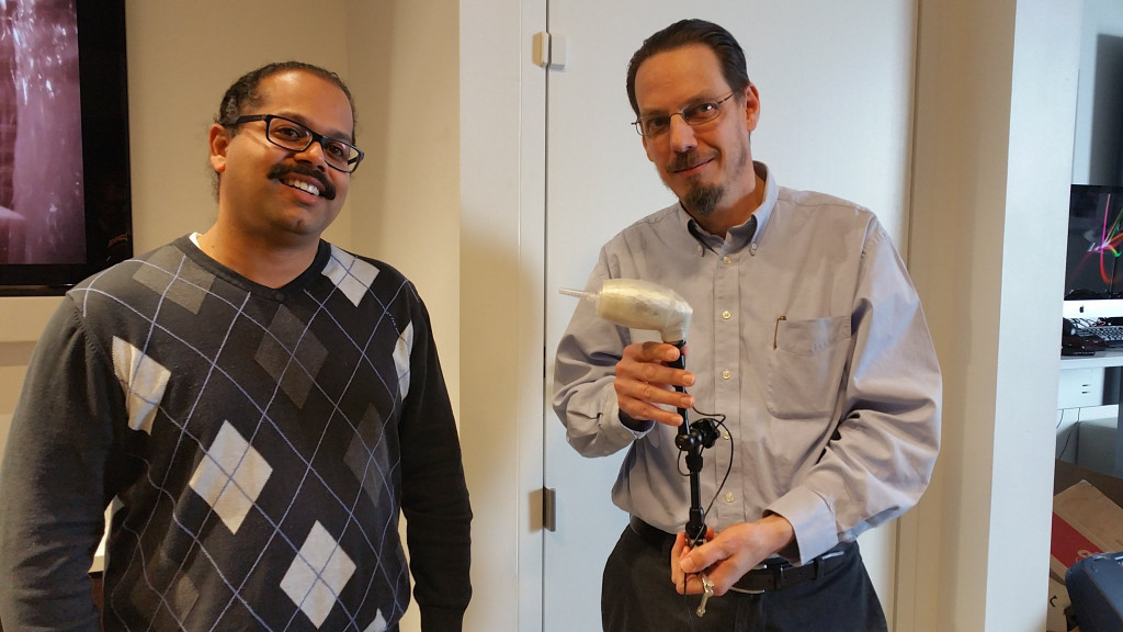 Jason and Scott, of Comcast, show off the LipSync device they built.