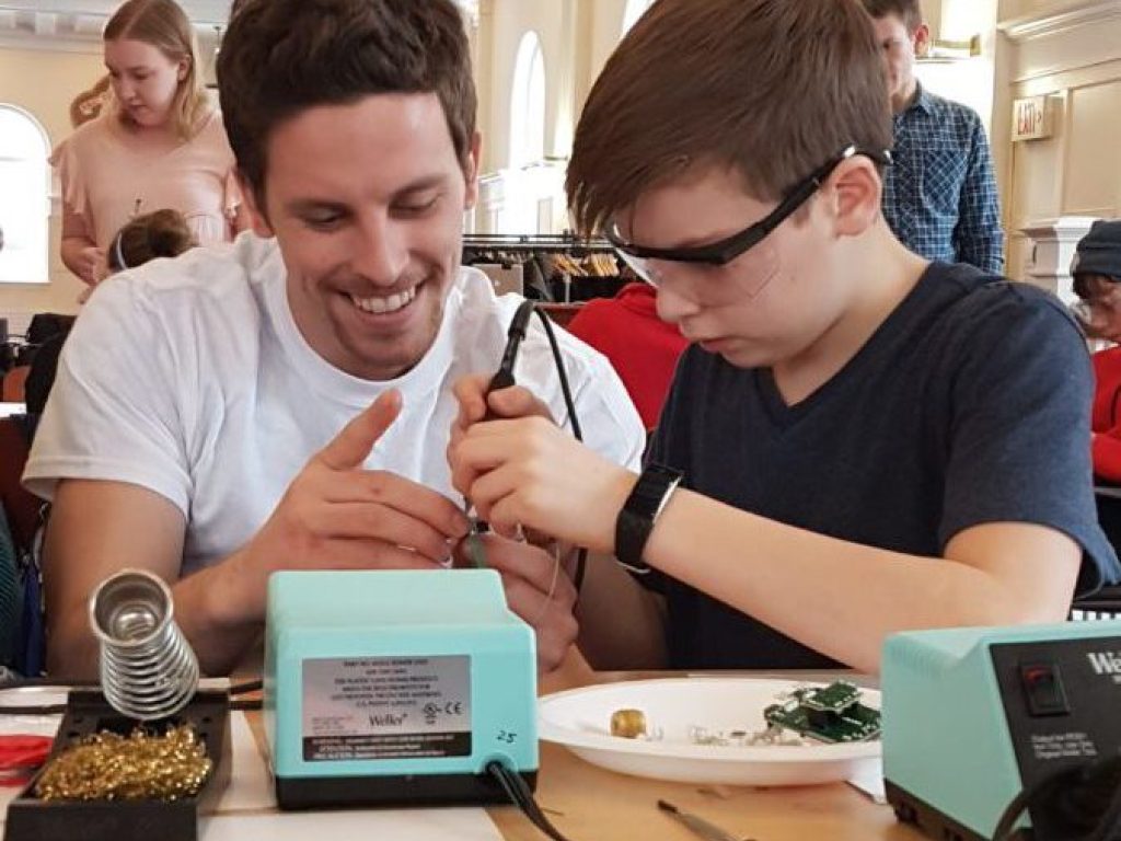 An Acadia University engineering student with a Wolfville School student