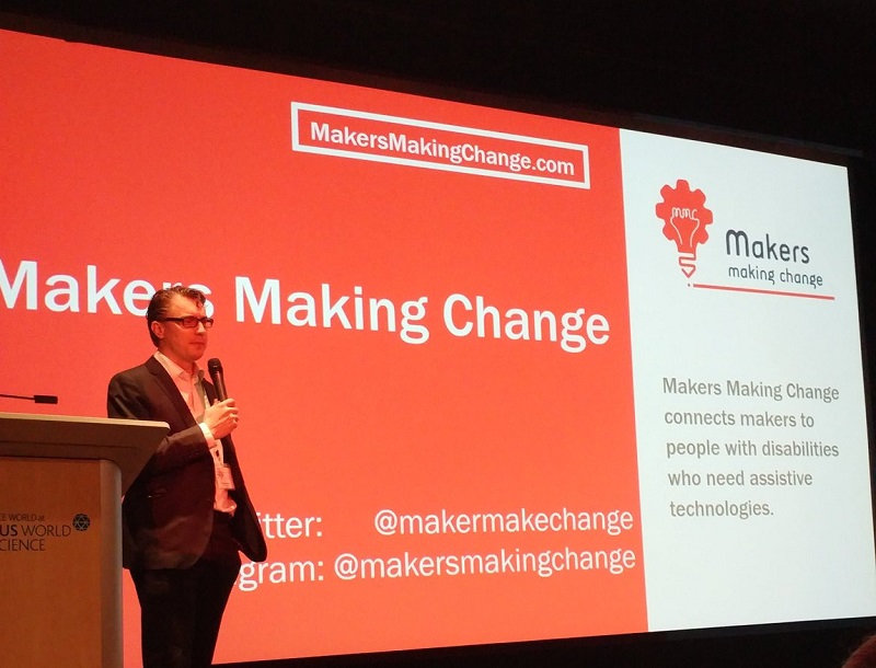 Chad Leaman delivering the keynote at STAN 2018 with a Makers Making Change backdrop