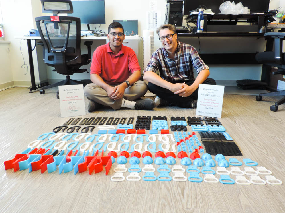 Fawzan, Director of Innovation, Chad Leaman, and printed parts