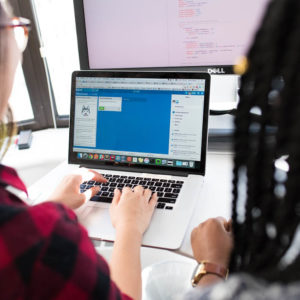 two people working at a computer