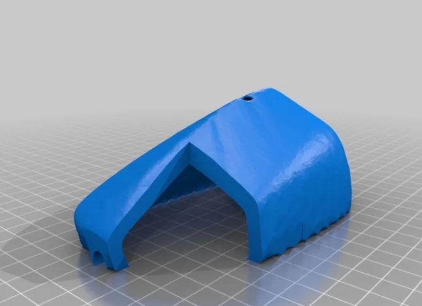 A blue 3D printed overlay that goes on top of a computer mouse.
