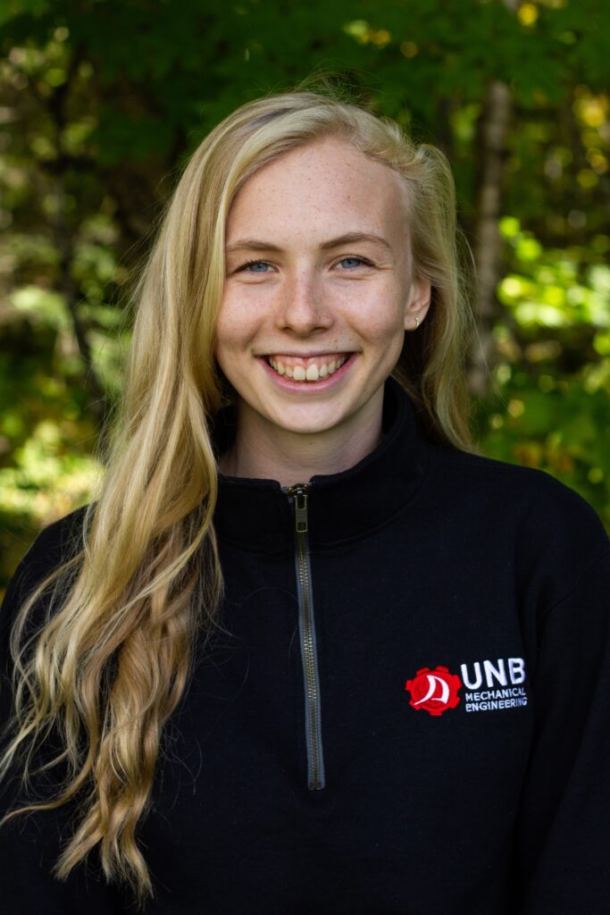 A picture of Kristin Higgins wearing a University of New Brunswick jacket