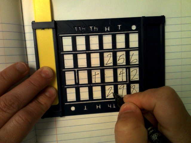 Picture of 3D printed guide for aligning written numbers