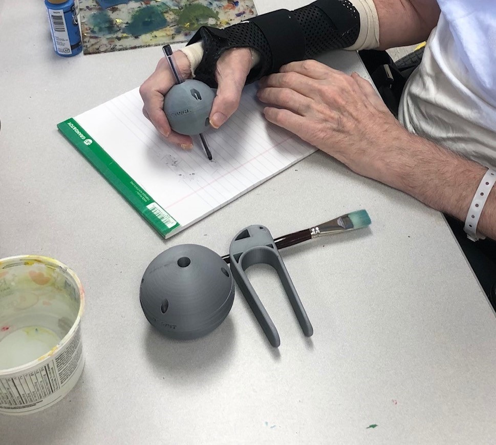 a person using a pen ball to write