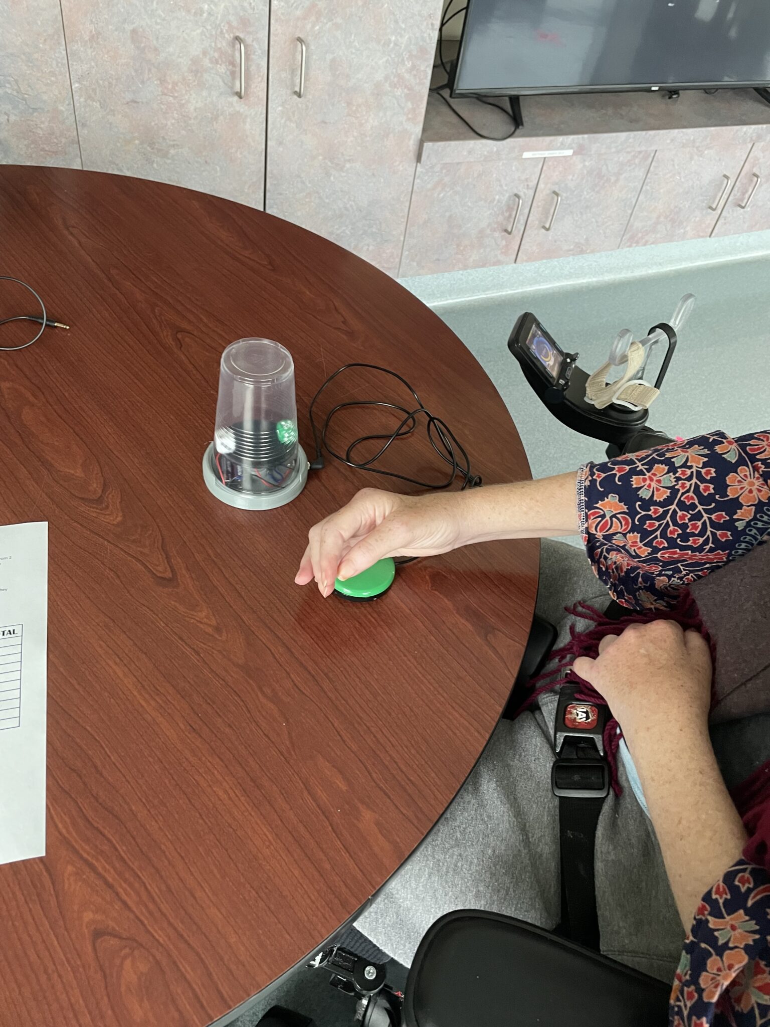 a person using a switch to activate a dice spinner
