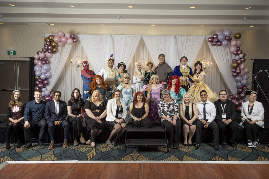 The Neil Squire Prairie Regional Staff posing with the Storybook Princess Parties cast.