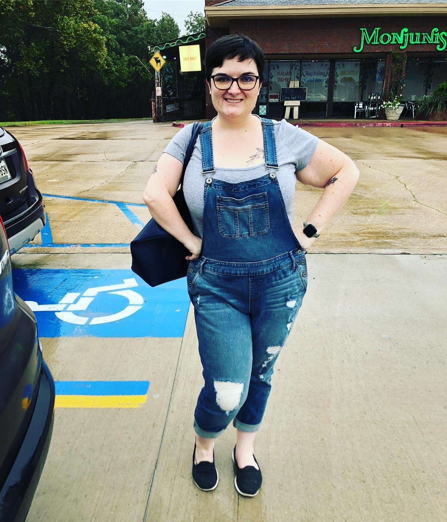 Ashley standing in a parking lot