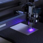 A laser cutter shooting a purple beam