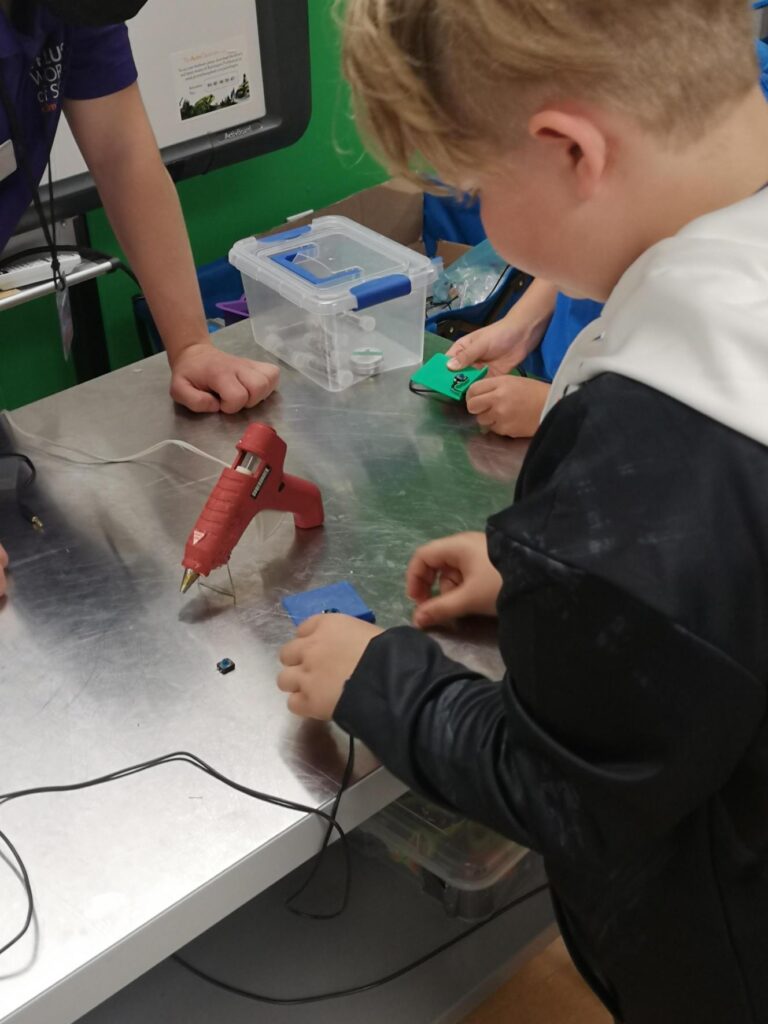 a kid working on a device at the TELUS World of Science Edmonton build