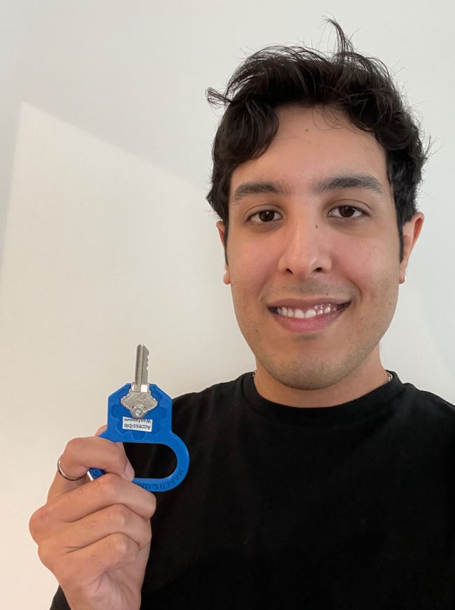 MMC intern Kyle holding up a key turner