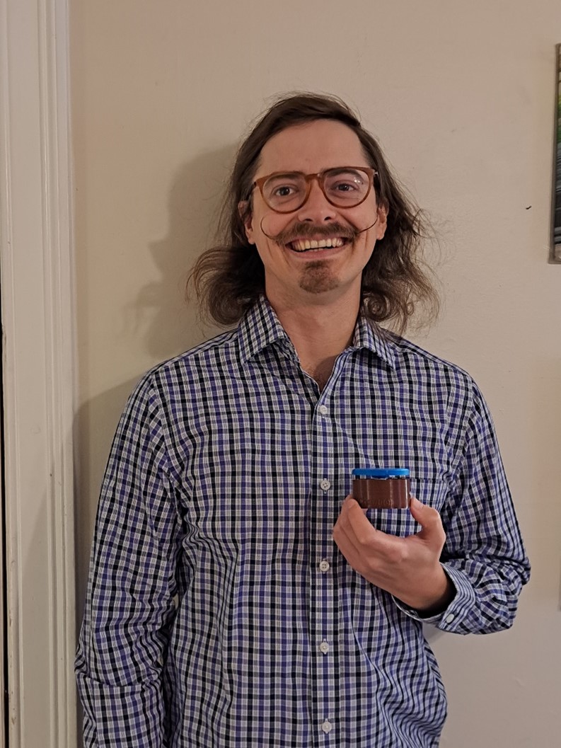 MMC intern Stephan holding an MMC60 Switch