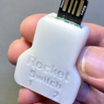 a hand holding a Rocket Switch