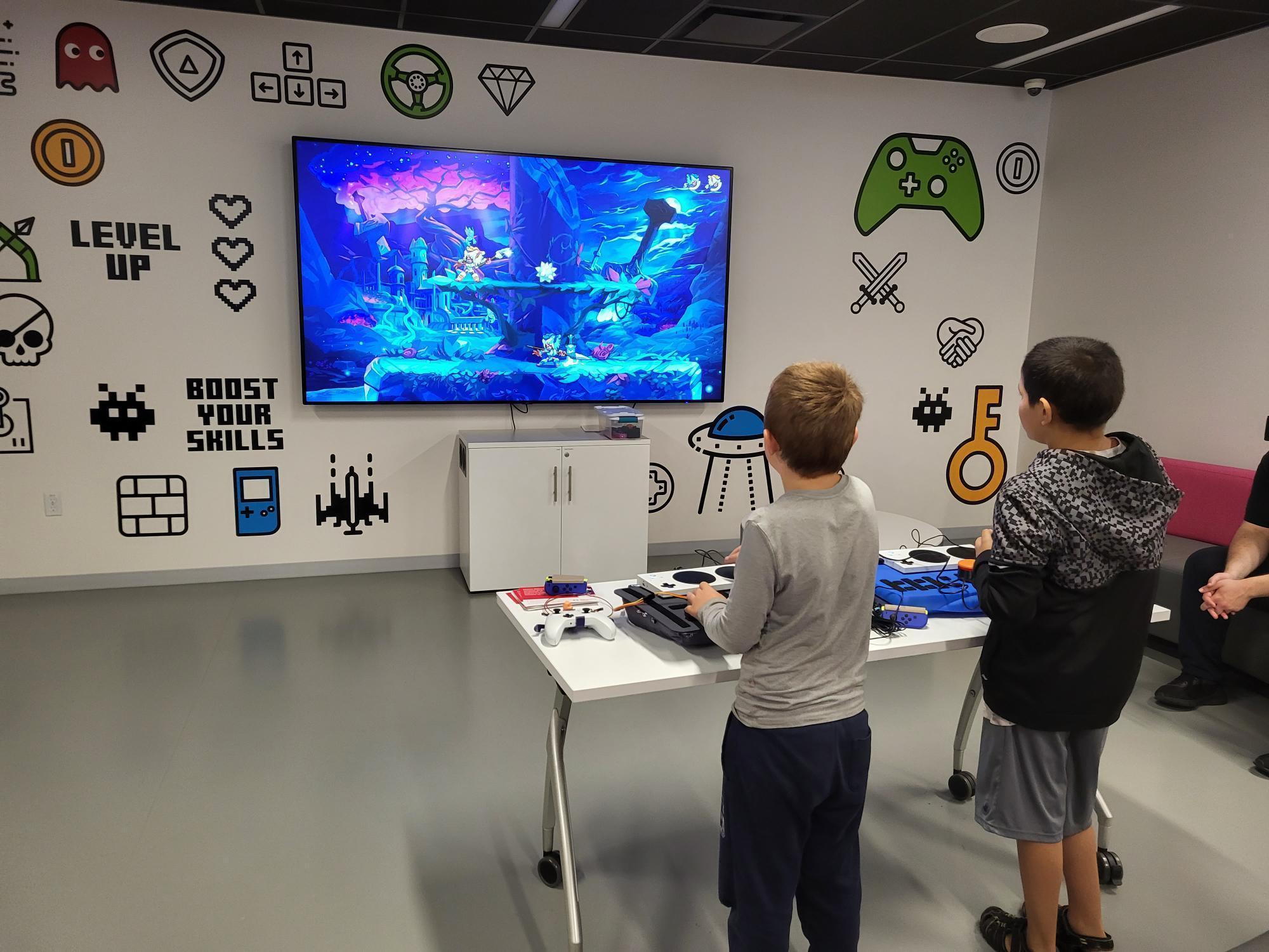 two children playing an Adaptive Gaming demo
