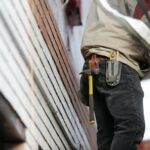 a contractor wearing a toolbelt