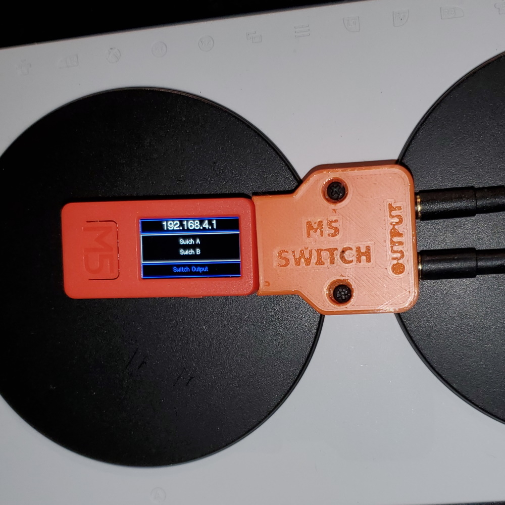 M5-Access-Switch-Output placed over Xbox Adaptive Controller.
