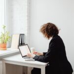 a woman working on a laptop