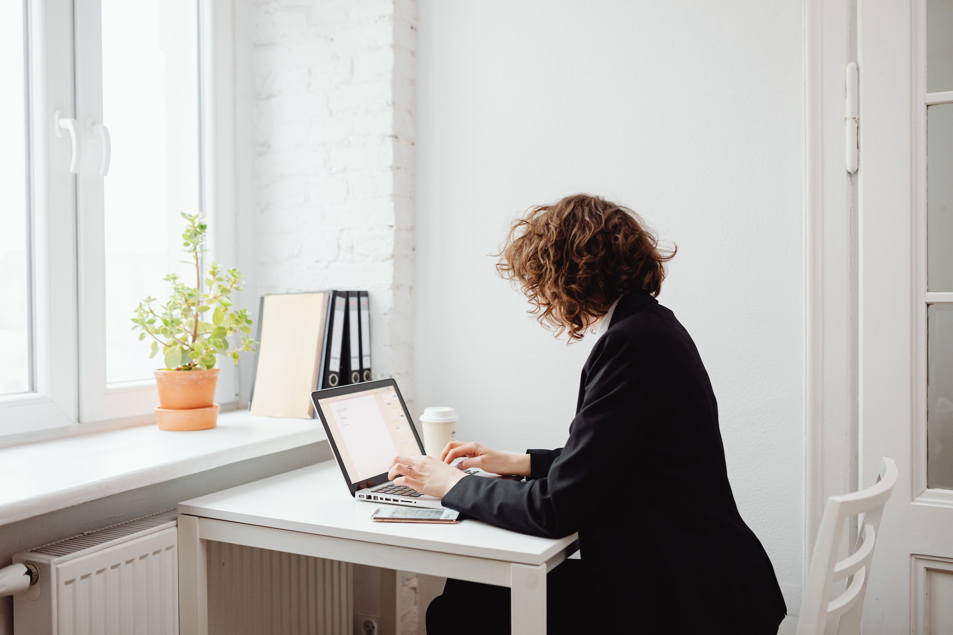 a woman working on a laptop
