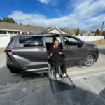 WorkBC Assistive Technology Services participant Kelly coming down a ramp from his wheelchair accessible van