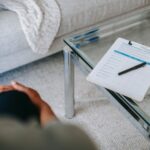 a professional looking over a checklist with depression and anxiety symptoms.