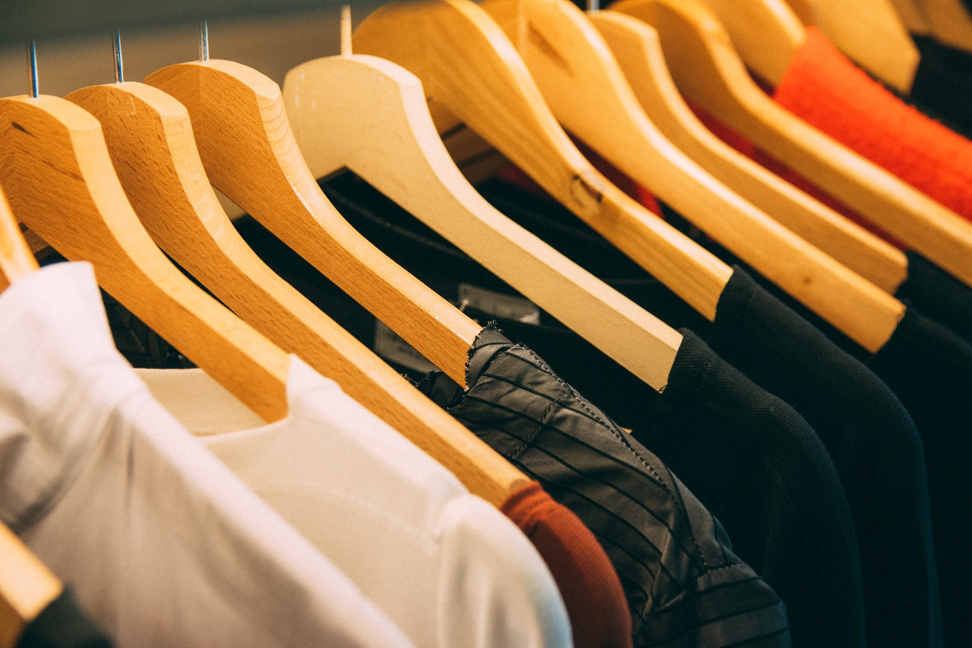 Clothes hanging on a rack.