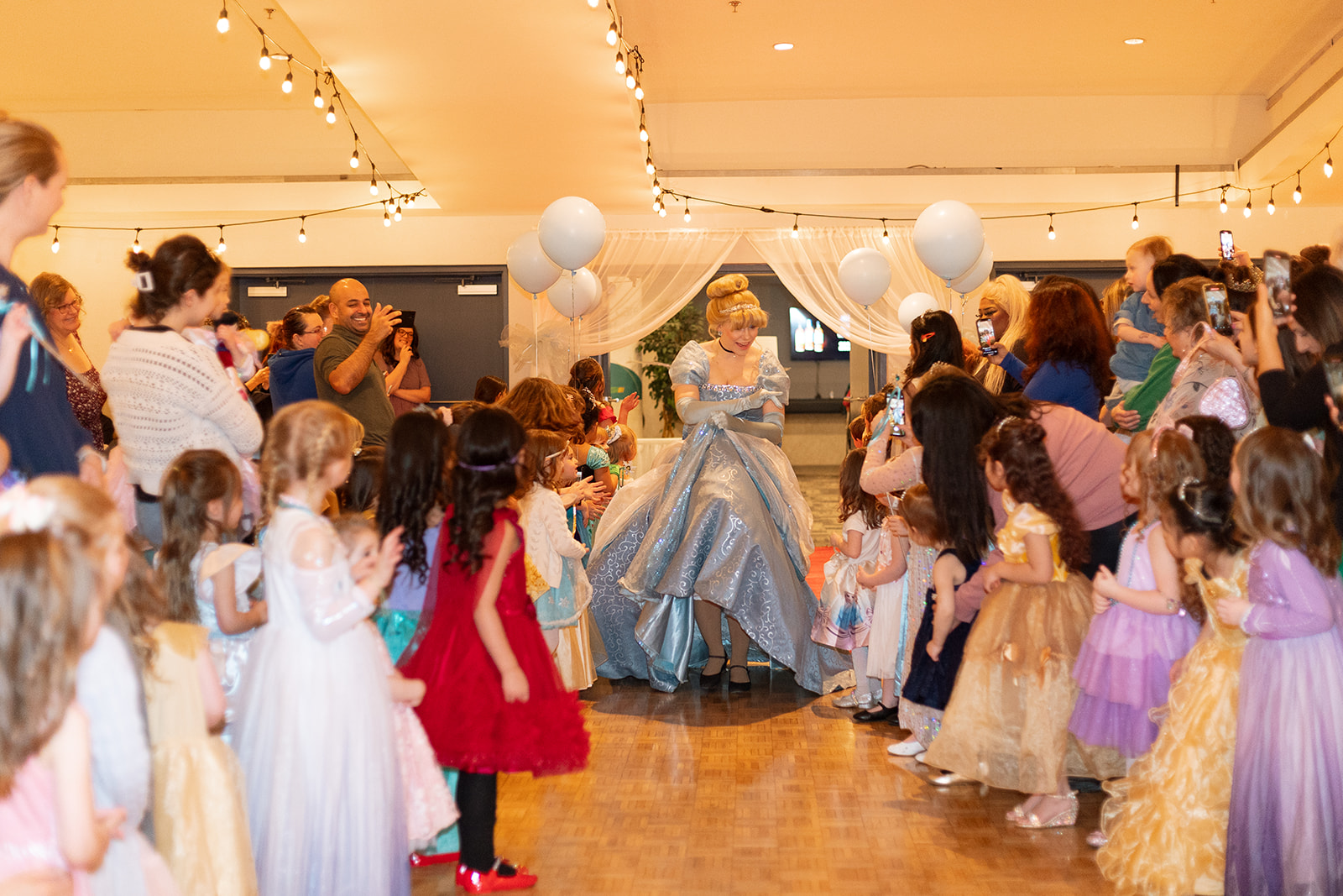 A Storybook princess performer greets the children in attendance.