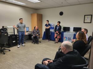 Senior Case Manager Kakie Wong makes a presentation.