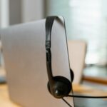 A headset resting on a laptop