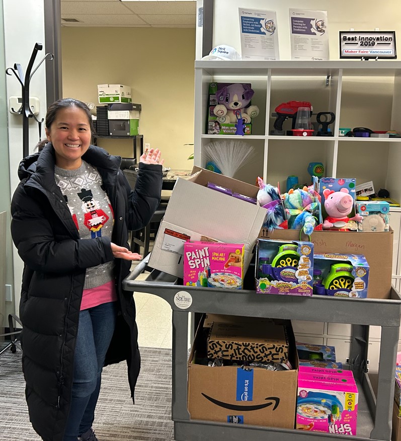 Kim with a cart of adapted toys.