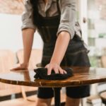 A server cleans a table.