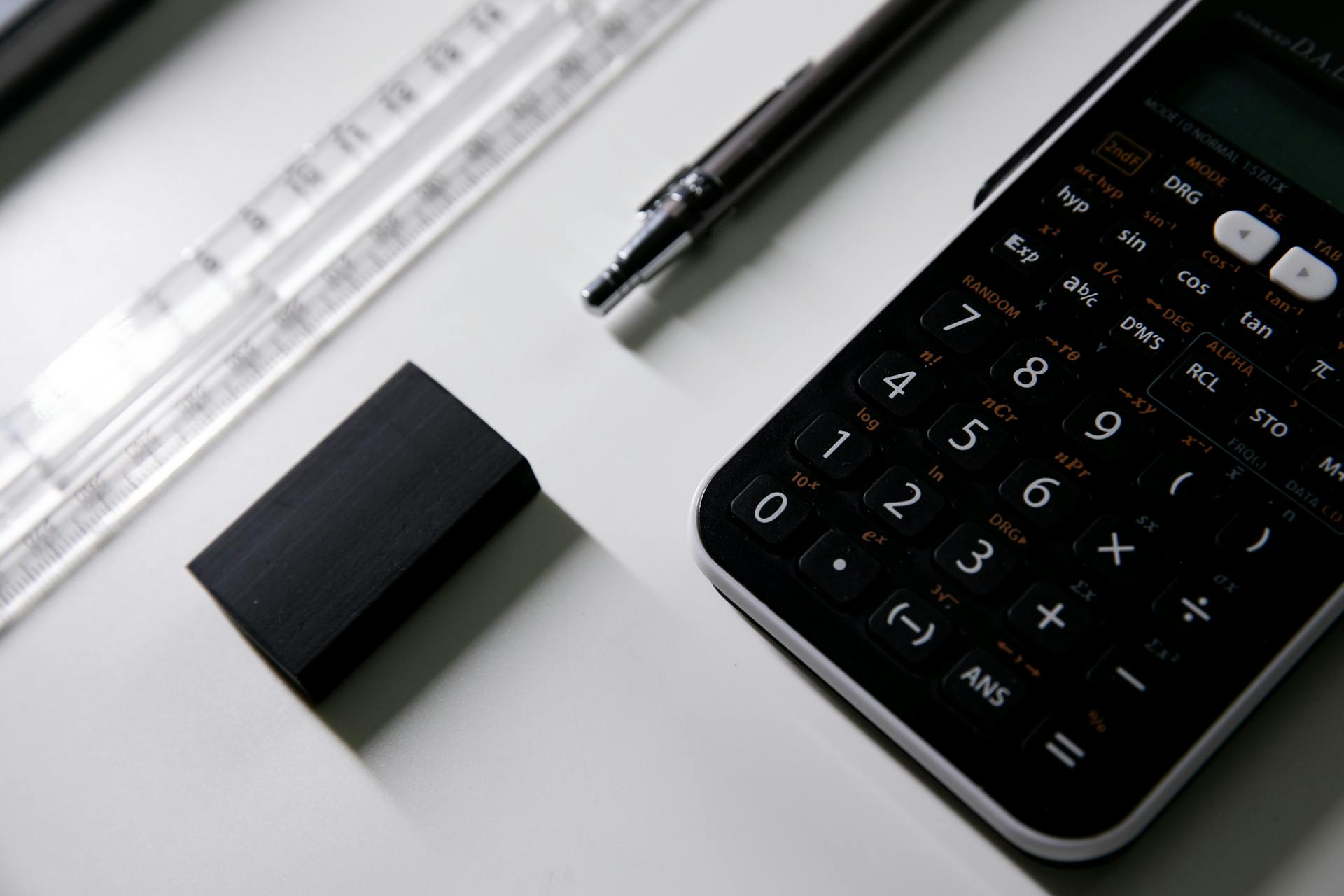 A ruler, pencil, eraser, and calculator.