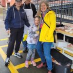 Atlantic Regional Director Bev Grasse with grillmaster Richard Grasse, and Premier Susan Holt and her daughter.