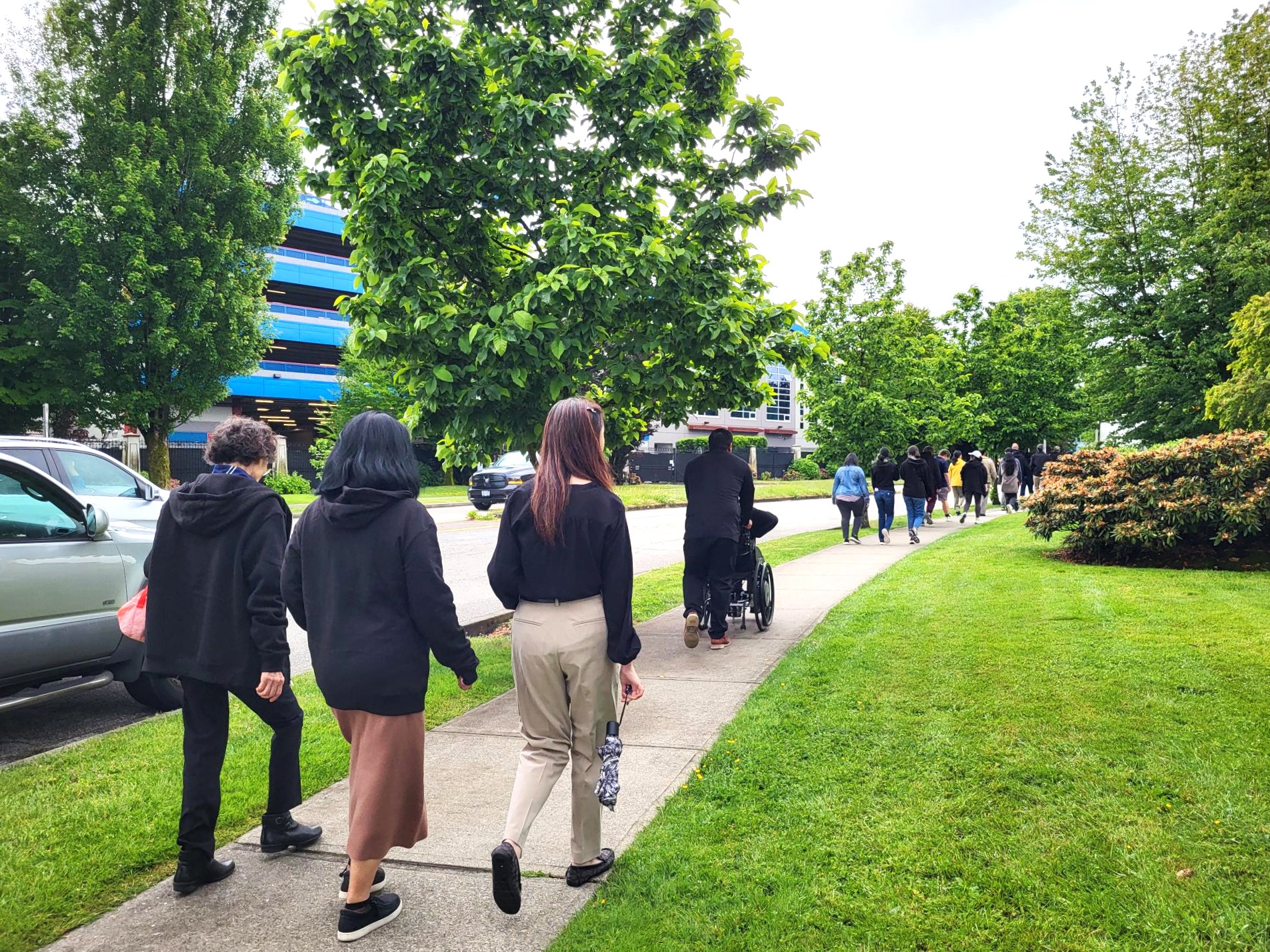 Burnaby staff, volunteers, and participants walking to the old office.