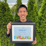 Ethan with his certificate for the award.