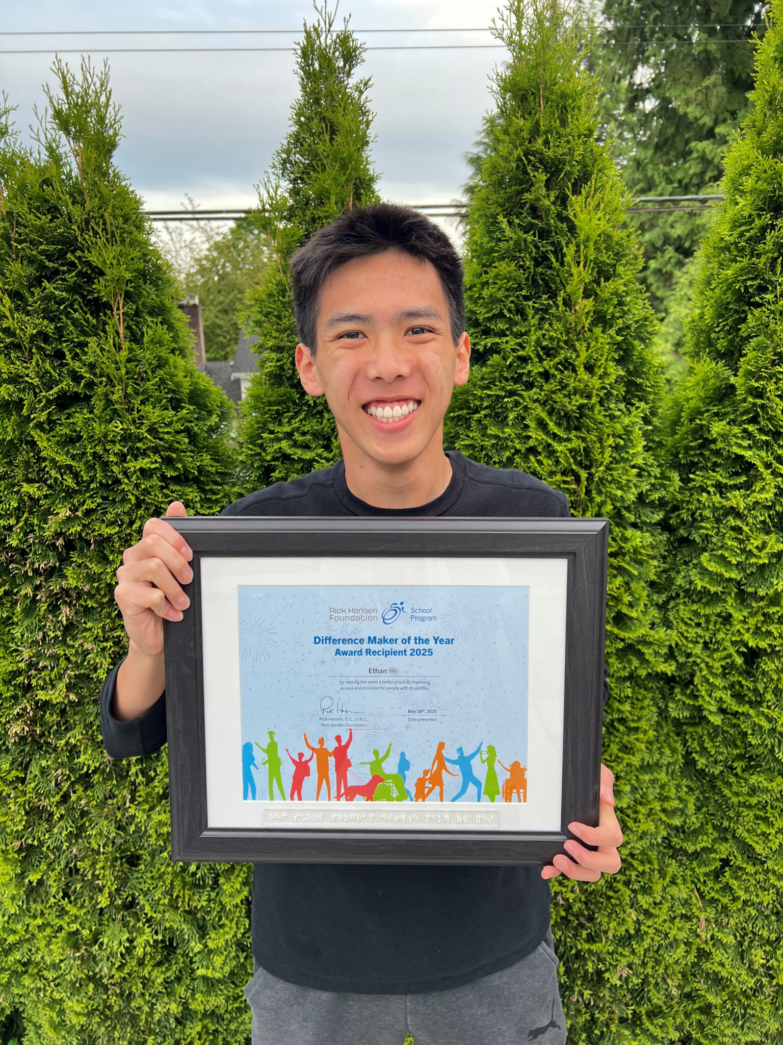 Ethan with his certificate for the award.