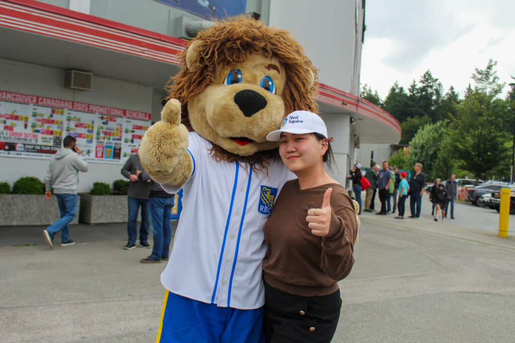 Patty poses for a photo with the RBC mascot, Leo the Lion.