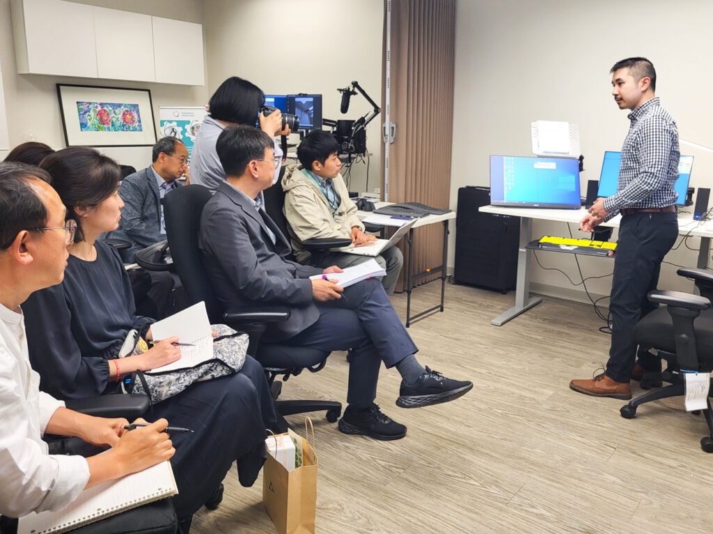 Eric leads the delegation through a demonstration of our Solutions lab.