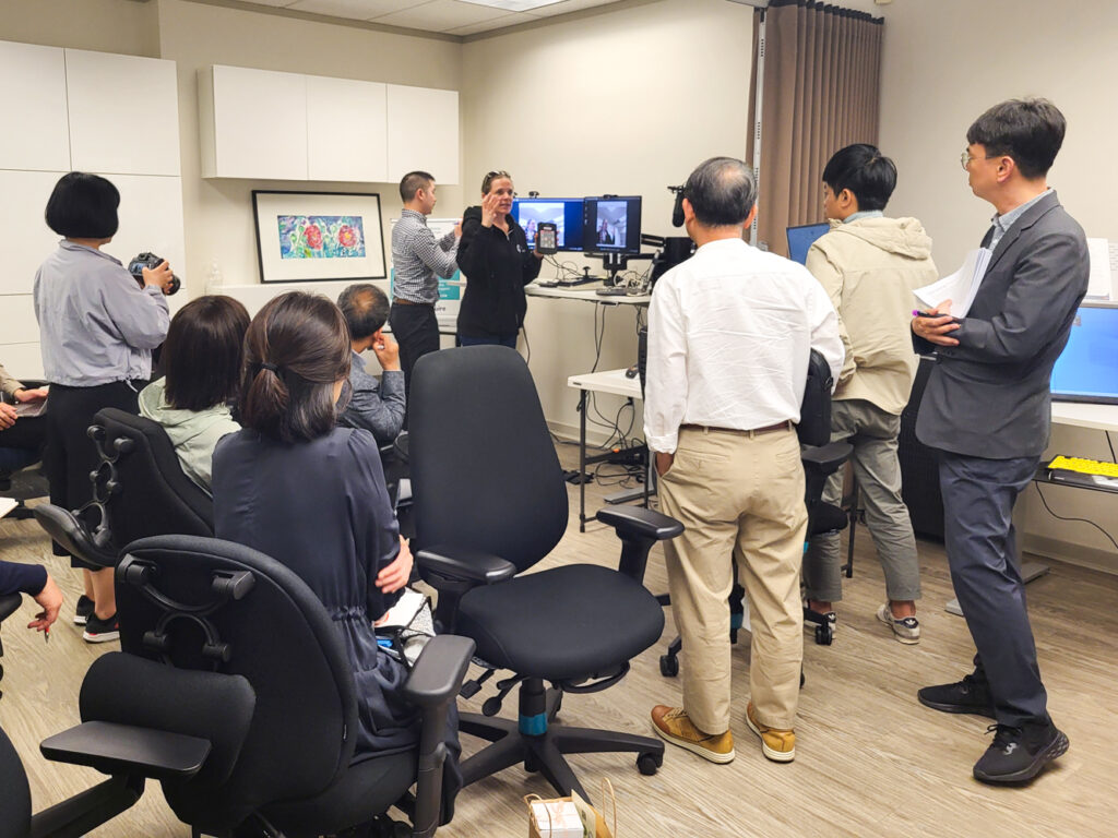 Eric and Jody lead the delegation through a demonstration of our Solutions lab.