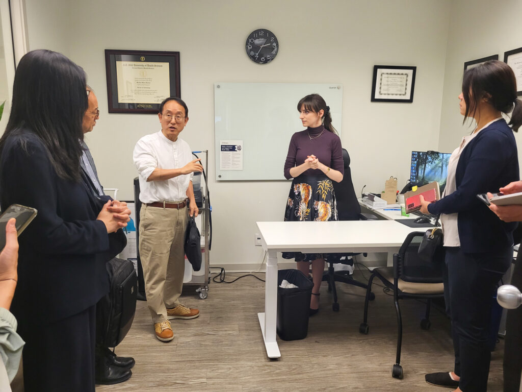 Heather leads the delegation through a demonstration of Hearing Solutions.