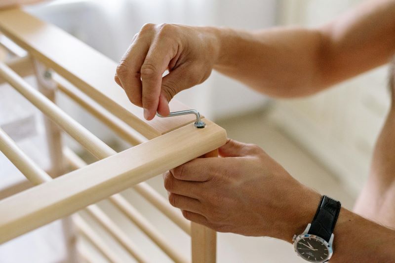 a person assembling furniture