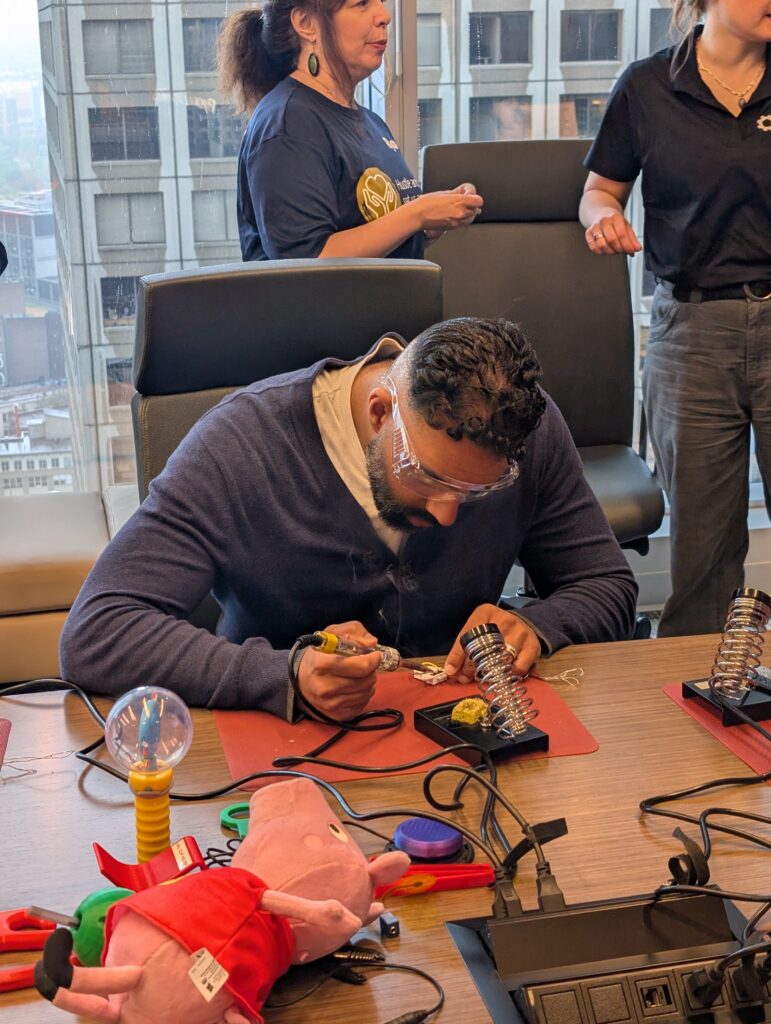 A man works on a device during a build at the Ryan Vancouver office.