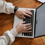 A person uses a laptop.